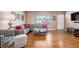 Living room with hardwood floors, gray sectional sofa, and wood coffee table at 12008 W Mexico Pl, Lakewood, CO 80228