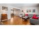 Open living and dining area with hardwood floors and vintage accents at 12008 W Mexico Pl, Lakewood, CO 80228