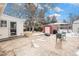 Backyard patio with shed and seating area, some snow present at 12008 W Mexico Pl, Lakewood, CO 80228