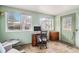 Sunroom with ample natural light and built-in workspace at 12008 W Mexico Pl, Lakewood, CO 80228