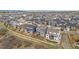 Aerial view of a neighborhood with single-Gathering homes, showcasing community layout at 174 Rockingham Cir, Castle Pines, CO 80108