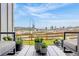 Relaxing back patio with views of the natural landscape and comfortable outdoor seating at 174 Rockingham Cir, Castle Pines, CO 80108