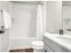 A modern bathroom featuring a shower-tub combo and white vanity with quartz countertop at 174 Rockingham Cir, Castle Pines, CO 80108
