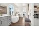 A luxurious bathroom features a soaking tub, double vanity, and walk in closet at 174 Rockingham Cir, Castle Pines, CO 80108