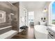 This bathroom features a glass enclosed shower, soaking tub and double sink at 174 Rockingham Cir, Castle Pines, CO 80108