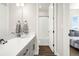 Bright bathroom featuring a white countertop, gray vanity, and a shower/tub combination at 174 Rockingham Cir, Castle Pines, CO 80108