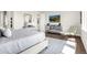 Bright bedroom boasts wood floors, designer rug, and stylish furnishings and decor at 174 Rockingham Cir, Castle Pines, CO 80108