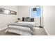 A well lit bedroom features a large window, grey decor, and a modern lamp at 174 Rockingham Cir, Castle Pines, CO 80108