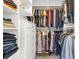 Well-organized walk-in closet with shelves, drawers, and hanging rods for ample storage at 174 Rockingham Cir, Castle Pines, CO 80108