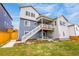 A multi-story home featuring a spacious backyard, deck, patio and backyard at 174 Rockingham Cir, Castle Pines, CO 80108
