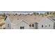 Aerial close-up of a well-maintained roof with gray siding and a view of the surrounding neighborhood at 174 Rockingham Cir, Castle Pines, CO 80108