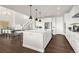 Spacious kitchen with white cabinets, stainless appliances, and a central island, perfect for entertaining at 174 Rockingham Cir, Castle Pines, CO 80108