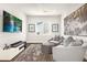 Comfortable seating area with modern media center and an accent rug at 174 Rockingham Cir, Castle Pines, CO 80108