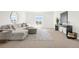 Relaxing living room featuring neutral tones, a comfortable couch, and natural light from the window at 174 Rockingham Cir, Castle Pines, CO 80108