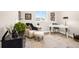 A cozy office features an accent chair and ottoman and a minimalist desk at 174 Rockingham Cir, Castle Pines, CO 80108