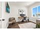 This office includes sleek desk with computer, chair, decorative rug, modern side table and an oversized window at 174 Rockingham Cir, Castle Pines, CO 80108