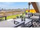 Outdoor patio with stylish furniture and a beautiful view of the grassy landscape at 174 Rockingham Cir, Castle Pines, CO 80108