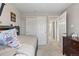 This bedroom offers ample closet space, neutral walls, and plush carpet making it a relaxing retreat at 5426 Bobcat St, Frederick, CO 80504