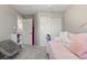 Comfortable bedroom featuring soft carpet, neutral walls, and a window, creating a tranquil and restful ambiance at 5426 Bobcat St, Frederick, CO 80504