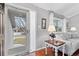 Welcoming foyer featuring hardwood floors, stylish console table, and a view of the living room at 5426 Bobcat St, Frederick, CO 80504