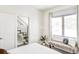 Well-lit bedroom featuring a window seat and modern finishes at 1218 Perry St, Denver, CO 80204