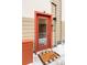 Modern burnt-orange front door with welcome mat at 1218 Perry St, Denver, CO 80204