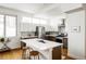 Modern kitchen with stainless steel appliances and island at 1218 Perry St, Denver, CO 80204