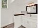 Bright bathroom with a modern vanity, mirror, and stylish lighting at 953 Gilia Dr, Golden, CO 80401