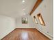 Bright bedroom with hardwood floors and skylight at 953 Gilia Dr, Golden, CO 80401