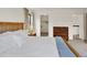 Bedroom with neutral-toned decor, wood furnishings, and walk in closet at 953 Gilia Dr, Golden, CO 80401