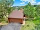 Charming exterior view of a two-story home with a brown shingle roof and attached garage at 953 Gilia Dr, Golden, CO 80401