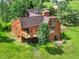 Aerial view of the well maintained wood home, with multiple decks, in a park-like setting at 953 Gilia Dr, Golden, CO 80401