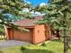 A ground level garage surrounded by beautiful evergreens at 953 Gilia Dr, Golden, CO 80401