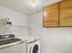 Bright laundry room equipped with a modern washer and dryer at 953 Gilia Dr, Golden, CO 80401