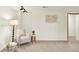Cozy living room featuring neutral carpet, modern lighting, and decorative wall art at 953 Gilia Dr, Golden, CO 80401