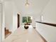 Open living room space with vaulted ceilings, natural light, and a large island countertop with seating at 953 Gilia Dr, Golden, CO 80401