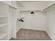 Spacious walk-in closet with carpet flooring and ample hanging storage space at 953 Gilia Dr, Golden, CO 80401