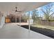 Covered back patio with a ceiling fan overlooking the backyard at 6325 W Portland Pl, Littleton, CO 80128
