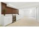 Finished basement featuring a modern bar with a wine fridge and updated cabinets at 6325 W Portland Pl, Littleton, CO 80128