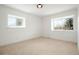 Comfortable bedroom bathed in natural light from its two windows at 6325 W Portland Pl, Littleton, CO 80128