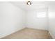A bright bedroom with white walls and a small window at 6325 W Portland Pl, Littleton, CO 80128