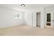 Bright bedroom with a closet for storage and an adjoining bathroom at 6325 W Portland Pl, Littleton, CO 80128