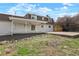 The exterior of the home highlighting its backyard, patio, and landscaping features at 6325 W Portland Pl, Littleton, CO 80128