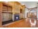 Inviting living room features custom built-ins, fireplace and hardwood flooring at 2366 Shore Side Dr, Berthoud, CO 80513