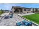 Beautiful backyard with a fire pit area, patio, turf, and outdoor seating, ideal for relaxation at 4213 Hickory Oaks St, Castle Rock, CO 80104
