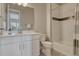 Nicely tiled bathroom with a white vanity, new fixtures, and shower/tub combo at 4213 Hickory Oaks St, Castle Rock, CO 80104