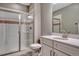 Modern bathroom featuring a glass-enclosed shower, white vanity, and a decorative tile accent for a sleek design at 4213 Hickory Oaks St, Castle Rock, CO 80104