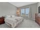 Bright bedroom with a comfortable bed, large windows, curtains, carpet and ample closet space at 4213 Hickory Oaks St, Castle Rock, CO 80104