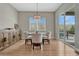 Dining room with hardwood floors, natural lighting, and sliding doors to the backyard at 4213 Hickory Oaks St, Castle Rock, CO 80104