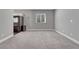 A spacious, carpeted flex space with a window and ample outlets, suitable for a variety of uses and designs at 4213 Hickory Oaks St, Castle Rock, CO 80104